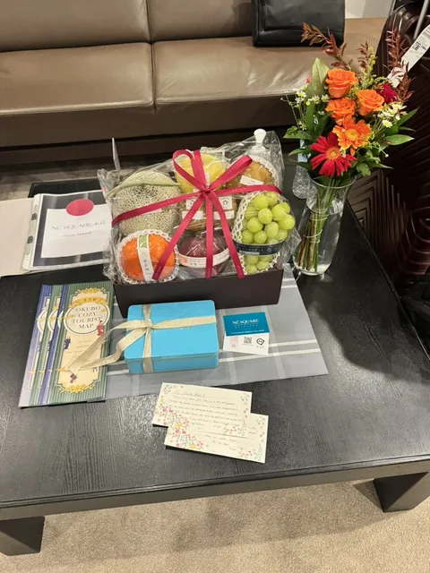 first thing waiting for us at the okubo airbnb in shinjuku: a wrapped gift basket of melon, grapes and oranges, fresh orange roses, a little blue box, and an "Okubo Cozy Town Map" steering us toward tokyo's Koreatown.