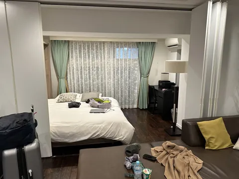 first night in our shinjuku place, suitcase still standing and my cap already ditched on the ottoman next to the snacks.