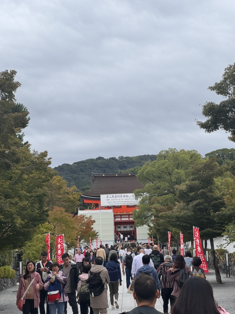 joining the crowd heading up to the MASSIVE fushimi inari shrine gates. christina snapped this during our morning visit - way busier than we expected for a tuesday.