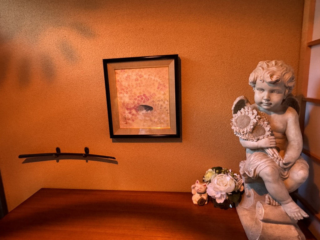 interesting mix of east meets west decor at our osaka airbnb - check out that tiny koi painting next to the random cherub