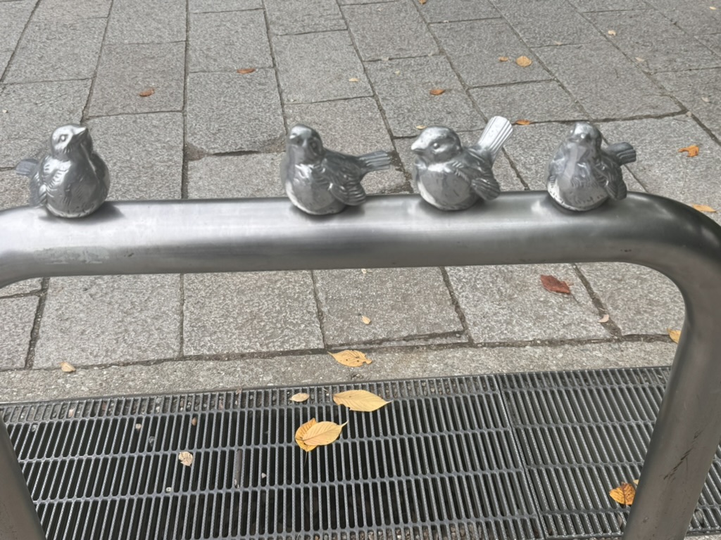 these tiny metal sparrows near osaka castle are actually part of the handrail design - japan's attention to detail is NEXT LEVEL