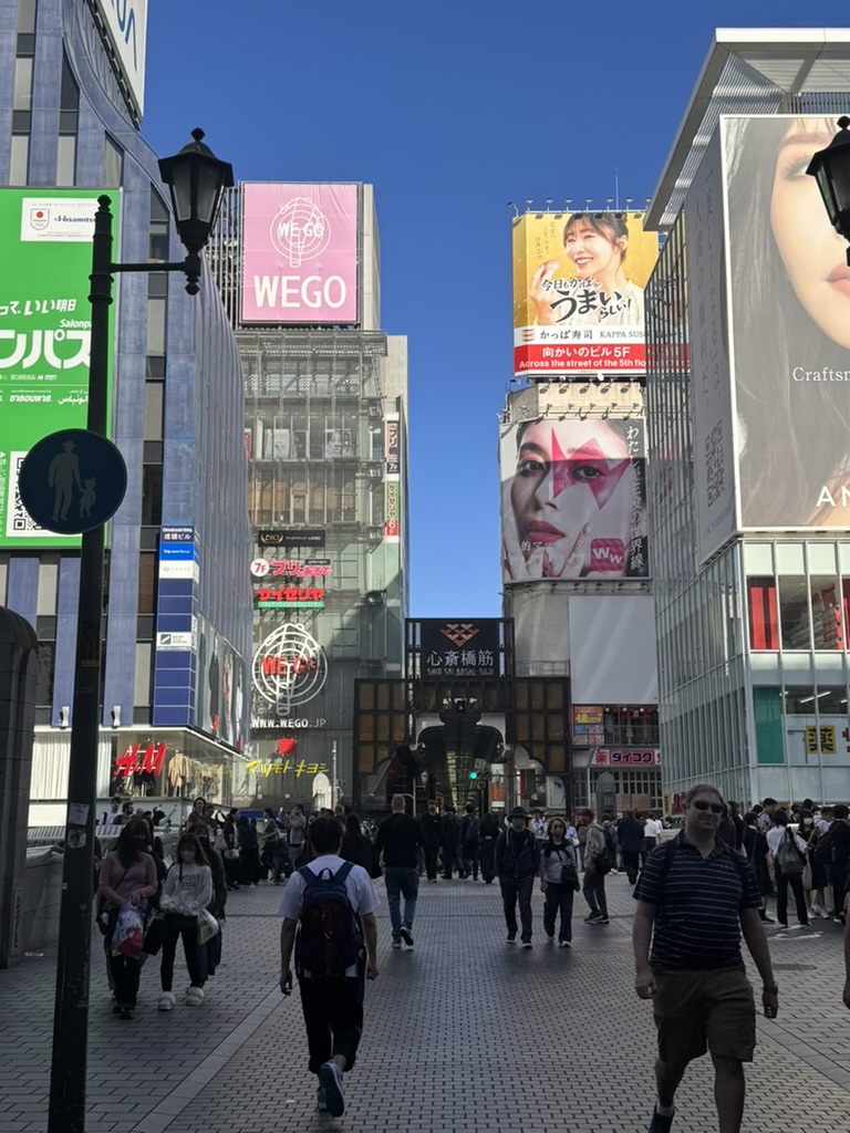 morning crowds starting to build in osaka's dotonbori district - the MASSIVE billboards and neon signs are exactly what we pictured japan would be like