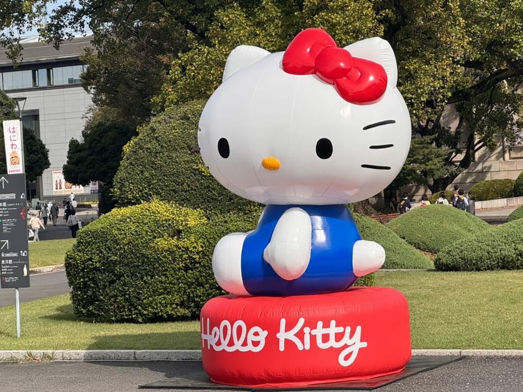 giant inflatable hello kitty greeting visitors outside the national museum in taito. christina couldn't pass up this peak japan moment.