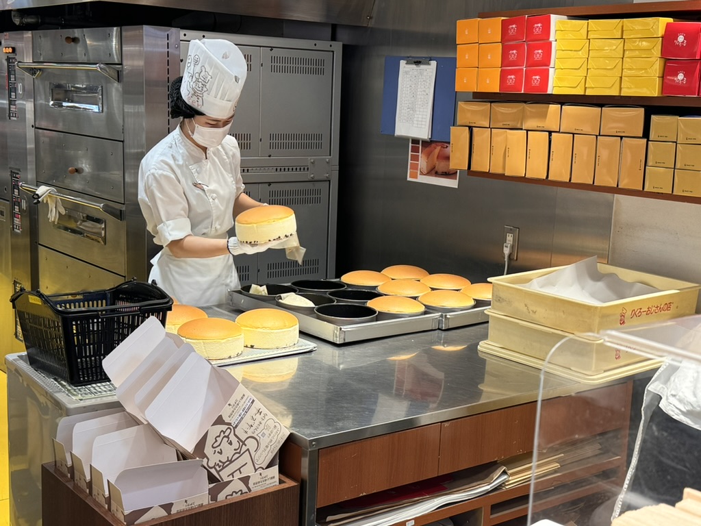 watching a baker prep fresh japanese cheesecakes at rikuro ojisan in osaka's namba district - these things are LEGENDARY