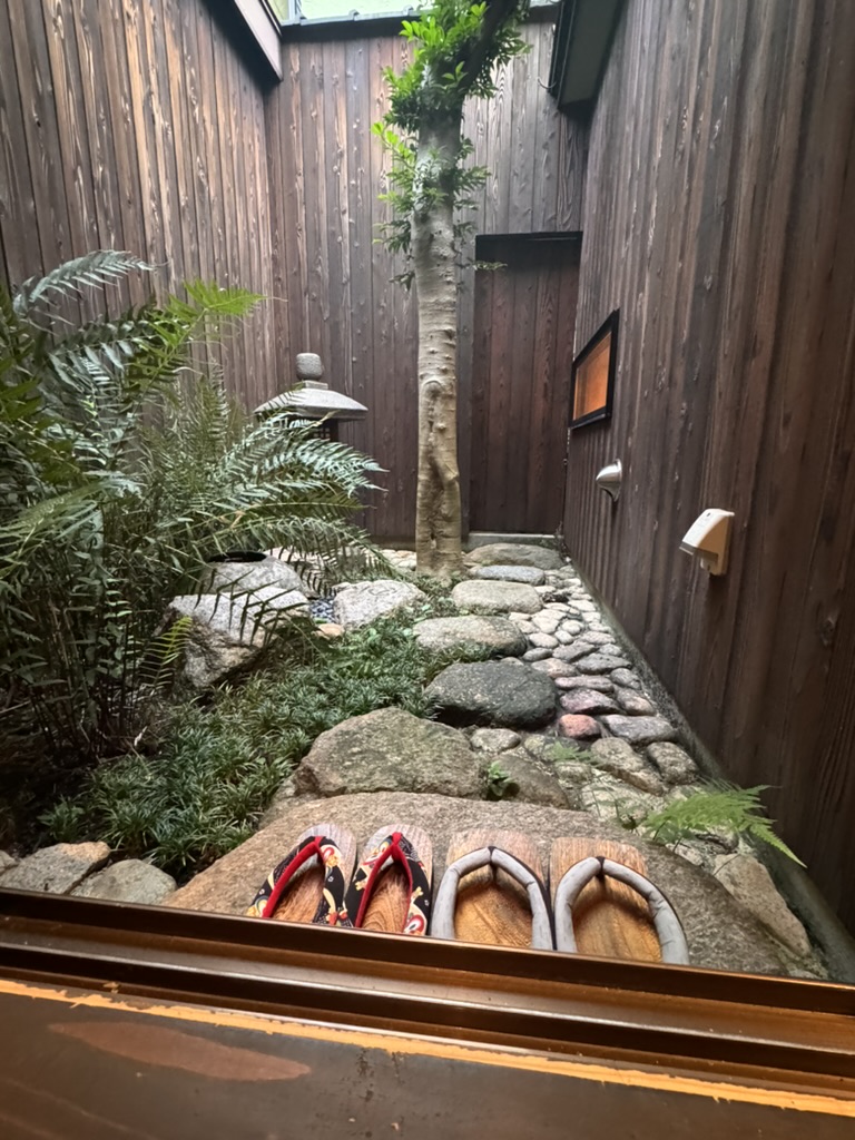 early morning at our osaka machiya - loving how they nailed these tiny garden details right down to the traditional slippers