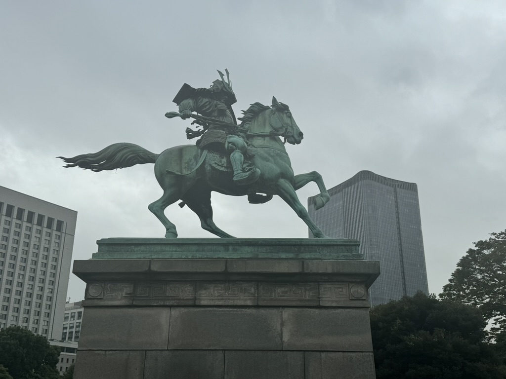 overcast morning at the imperial palace, where this MASSIVE samurai statue guards the entrance near marunouchi