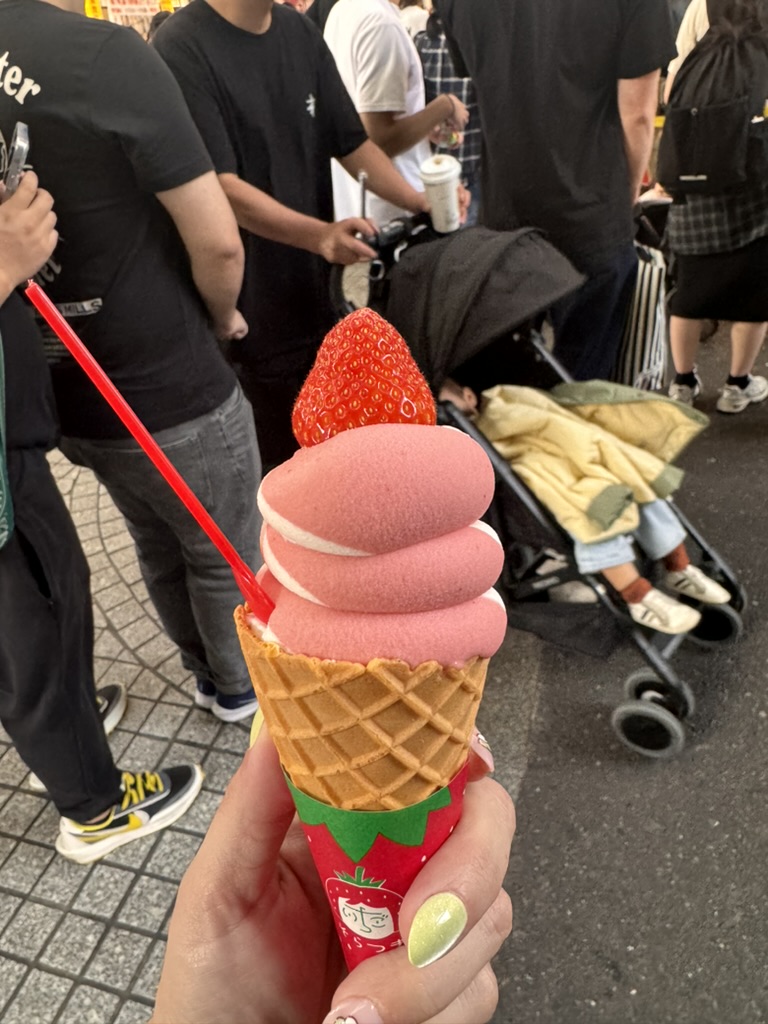 christina found this AMAZING strawberry soft serve while exploring dotonbori - the line was worth it for that perfect swirl and fresh berry on top