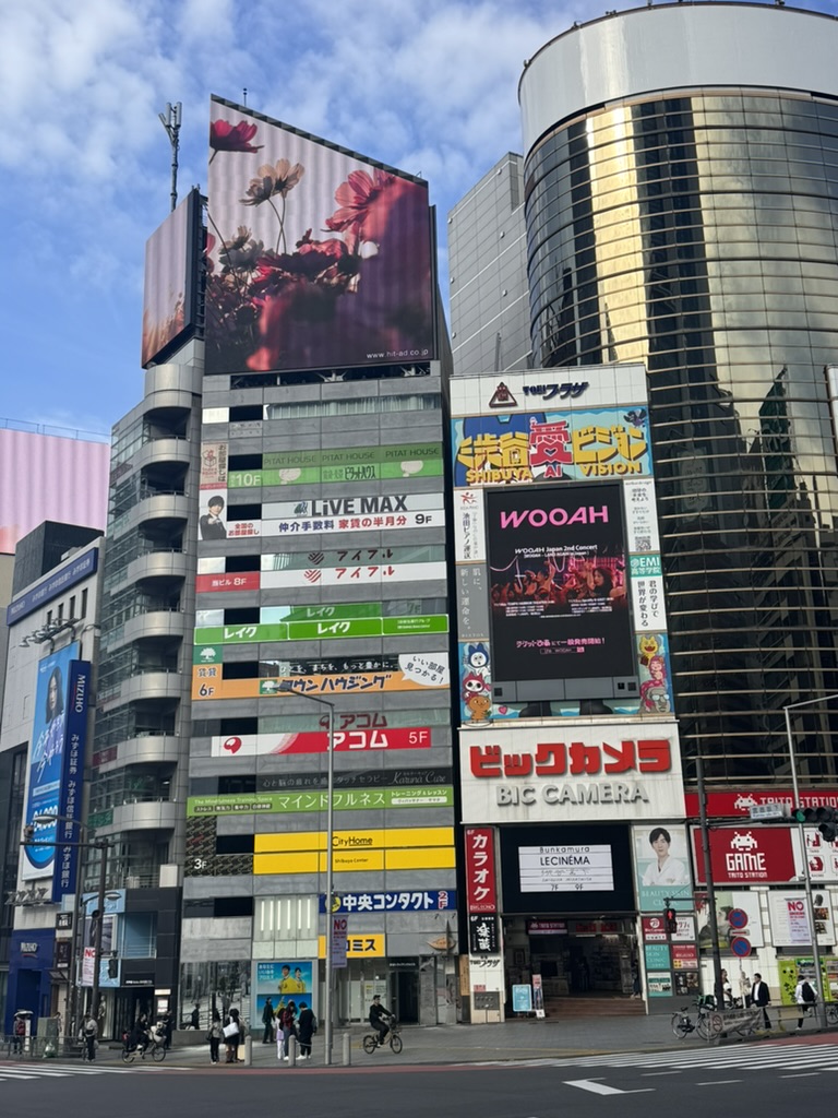 morning light hits the iconic big camera building in shibuya - christina caught this classic tokyo view near the scramble crossing