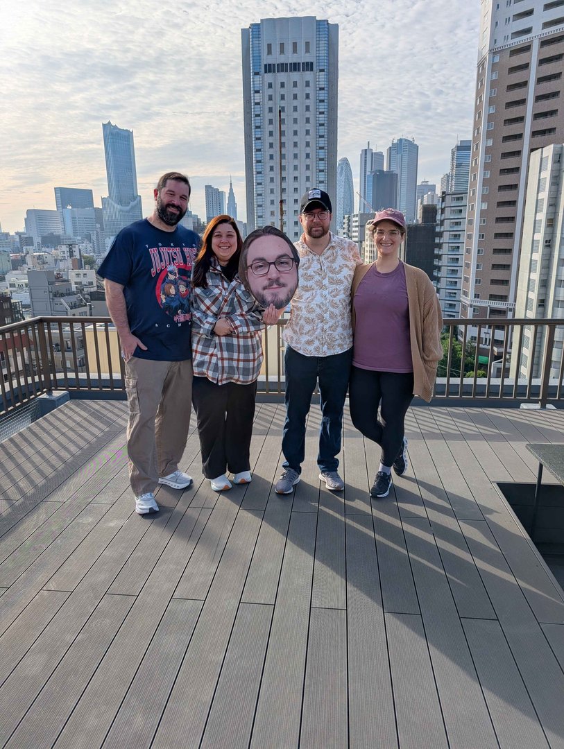 rooftop views of tokyo's shinjuku district with chuck, ashley, daniel and christina checking out the skyline from our airbnb