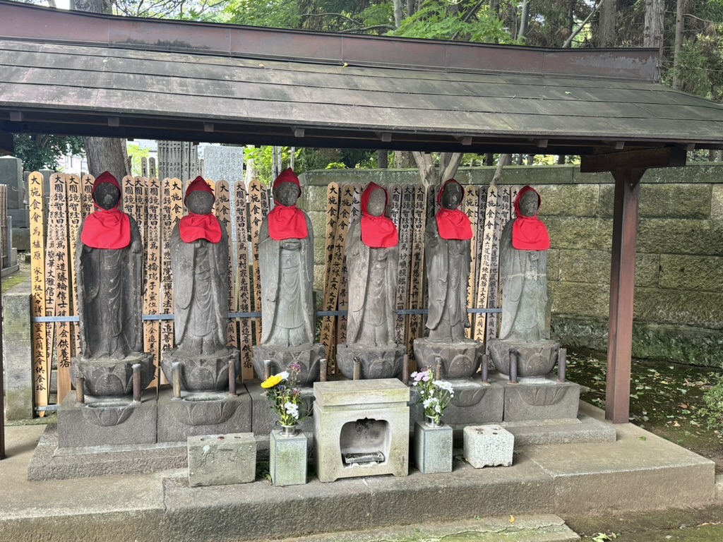 early morning wandering through setagaya led christina to these HAUNTING jizo statues with their iconic red bibs. these buddhist guardians are everywhere in tokyo once you start looking.