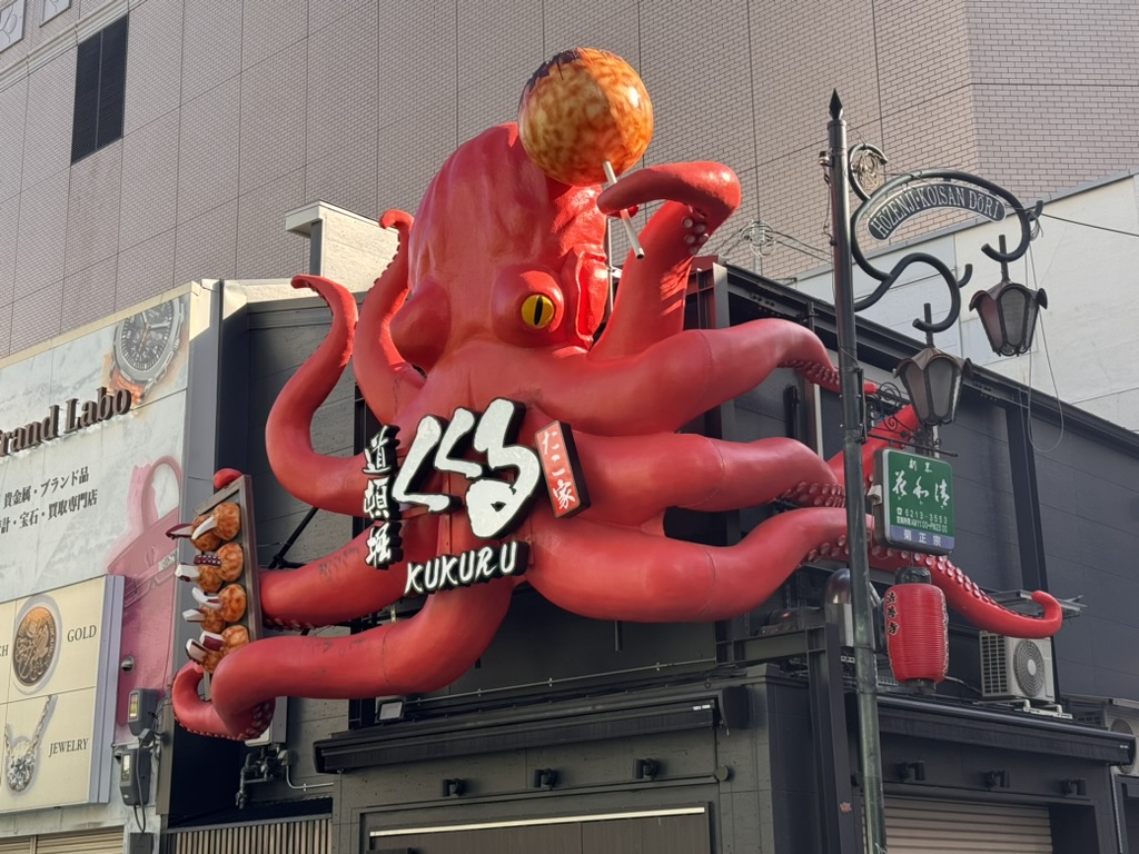 christina caught this MASSIVE red octopus sign in osaka's dotonbori district - these wild 3d signs are everywhere here