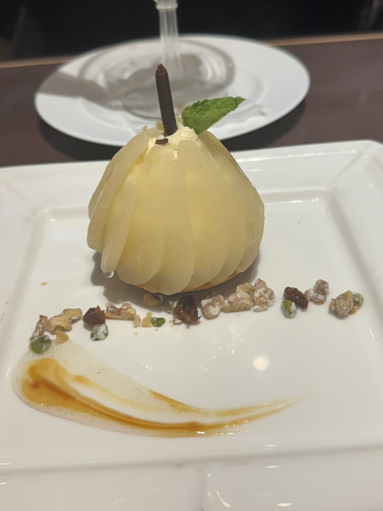 fancy japanese pear dessert at a restaurant in shinjuku - way more elegant than the convenience store snacks we've been living on