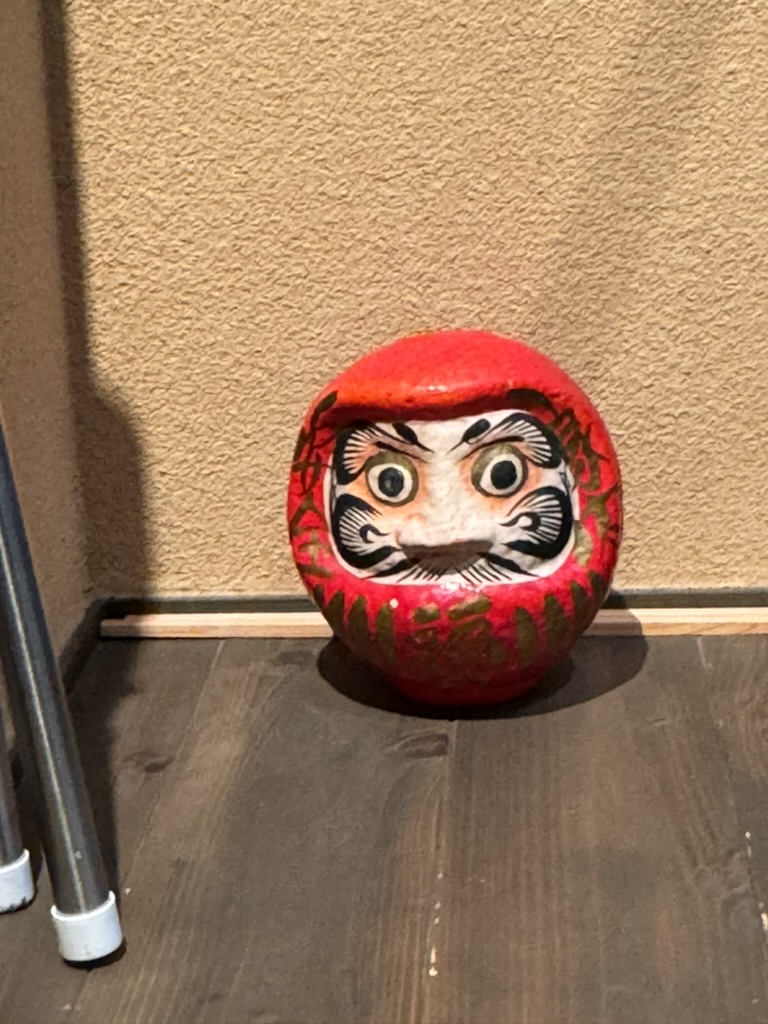 spotted this MASSIVE daruma doll at our osaka airbnb - christina's already thinking about what wish to make