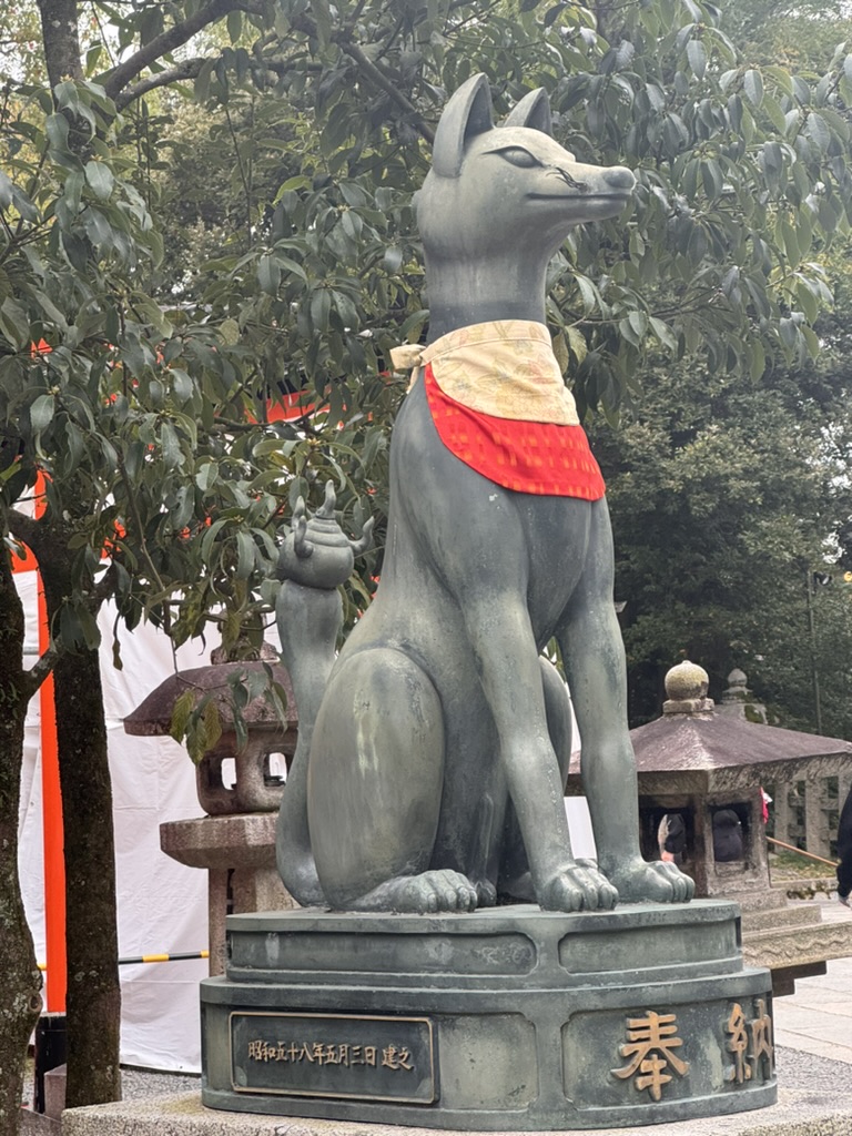 christina caught this iconic fox statue at fushimi inari shrine - these kitsune are said to be messengers of the rice god inari