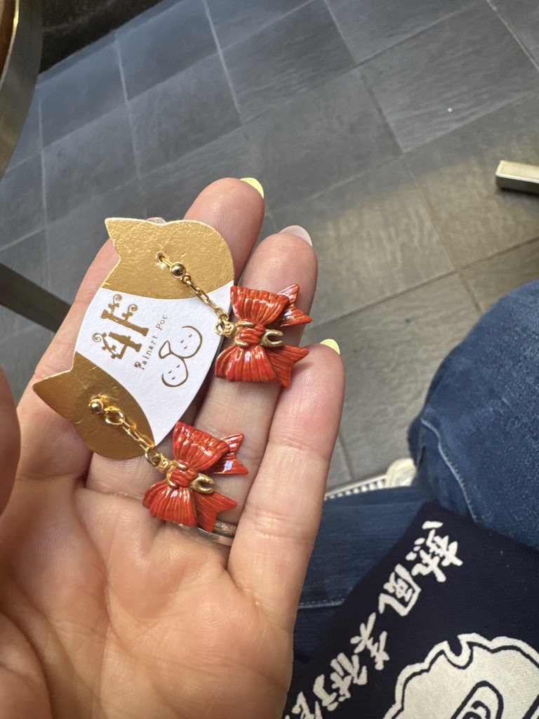 christina found these adorable mizuhiki earrings at a craft shop in kyoto - these traditional paper cord knots are usually used on fancy gift wrapping