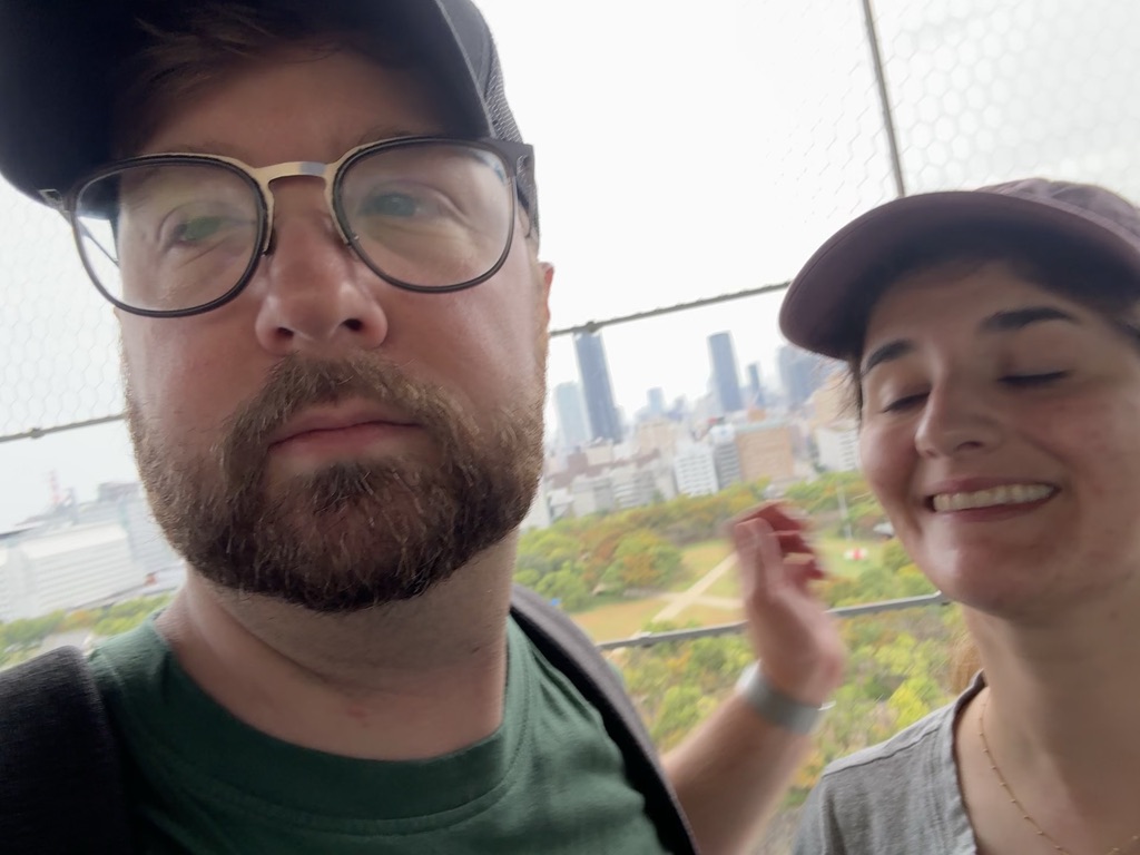 daniel and christina checking out the osaka skyline from osaka castle - you can see the fall colors starting to pop in the castle grounds below