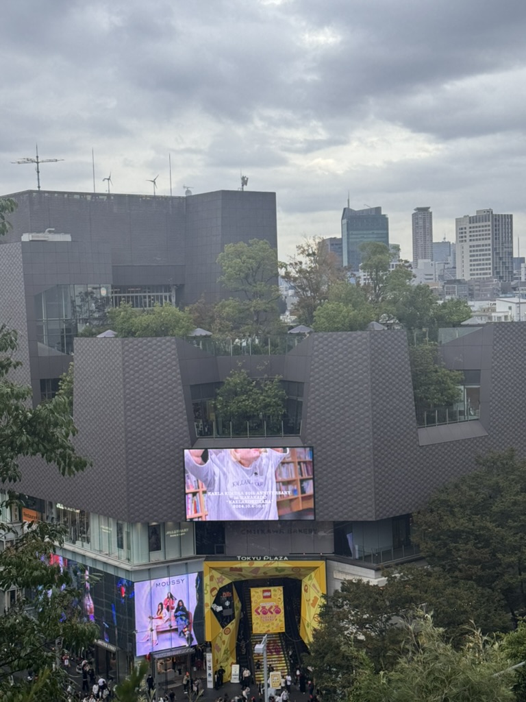 checking out the WILD architecture of tokyu plaza omotesando harajuku - those angular walls and digital billboards are peak tokyo