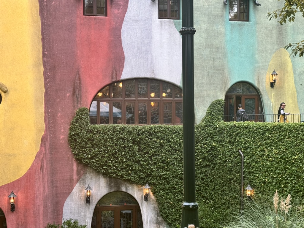 christina caught this shot of the ICONIC ghibli museum exterior with its whimsical miyazaki-inspired color blocks and ivy-covered walls in mitaka