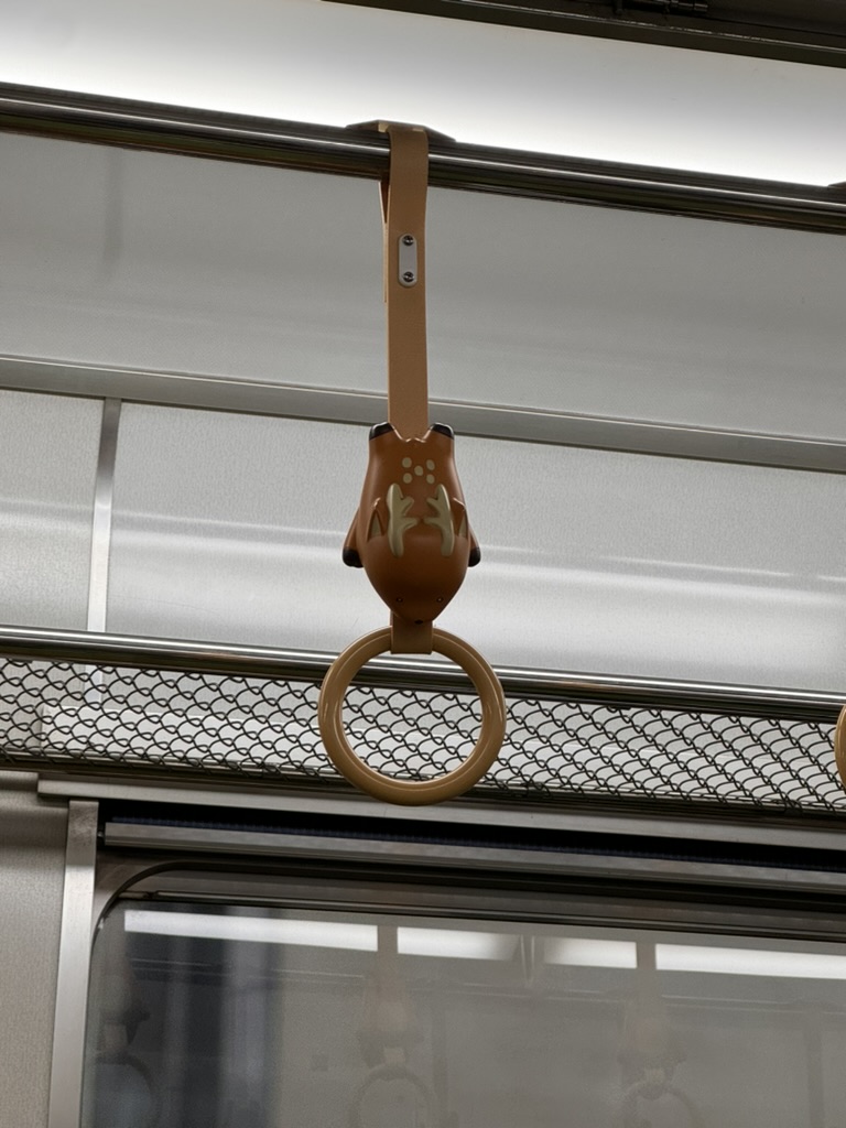 spotted these cute tanuki-themed train handles on our morning ride through osaka. these little details make japan's public transit NEXT LEVEL