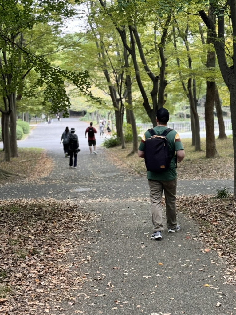 daniel exploring the peaceful paths around osaka castle park on a perfect fall morning. the trees were just starting to turn golden.