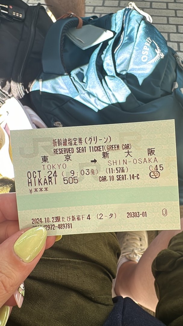 heading from tokyo to osaka on the HIKARI shinkansen, christina's yellow nails match the ticket perfectly