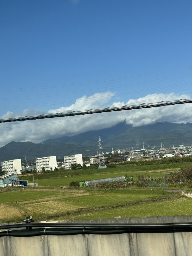 quick snap from the shinkansen window passing through hiratsuka - those apartment blocks against the mountains are peak japanese suburban vibes