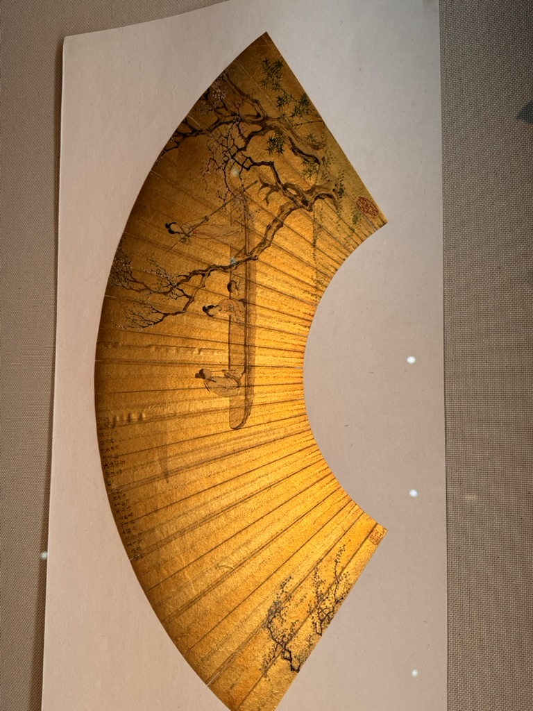 checking out this STUNNING gold folding fan with plum blossoms at the tokyo national museum - christina couldn't resist snapping a pic of the traditional craftsmanship