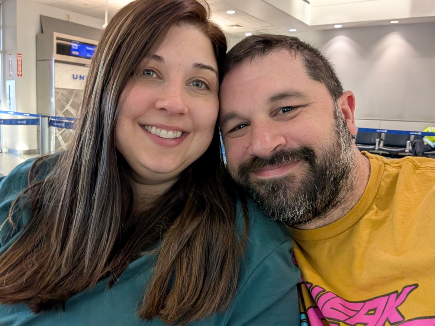 ashley and chuck at houston airport, ready to kick off their EPIC japan adventure