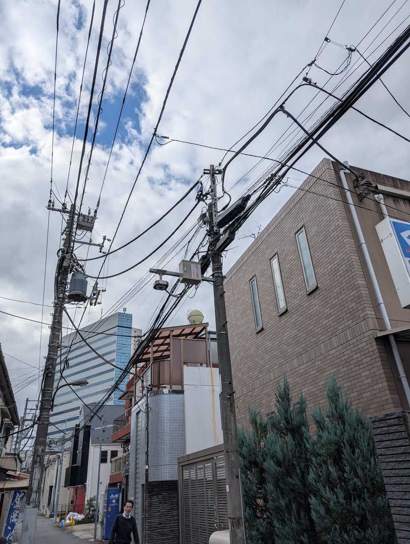 wandering the back streets of shinjuku, where the REAL tokyo reveals itself through tangled power lines and quiet neighborhoods