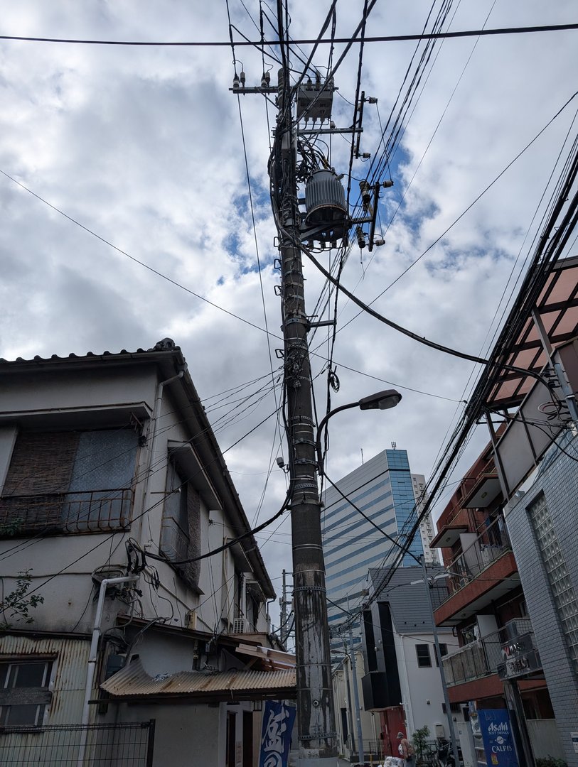 wandering through the back streets of shinjuku, where old tokyo meets new - those power lines are EVERYWHERE here