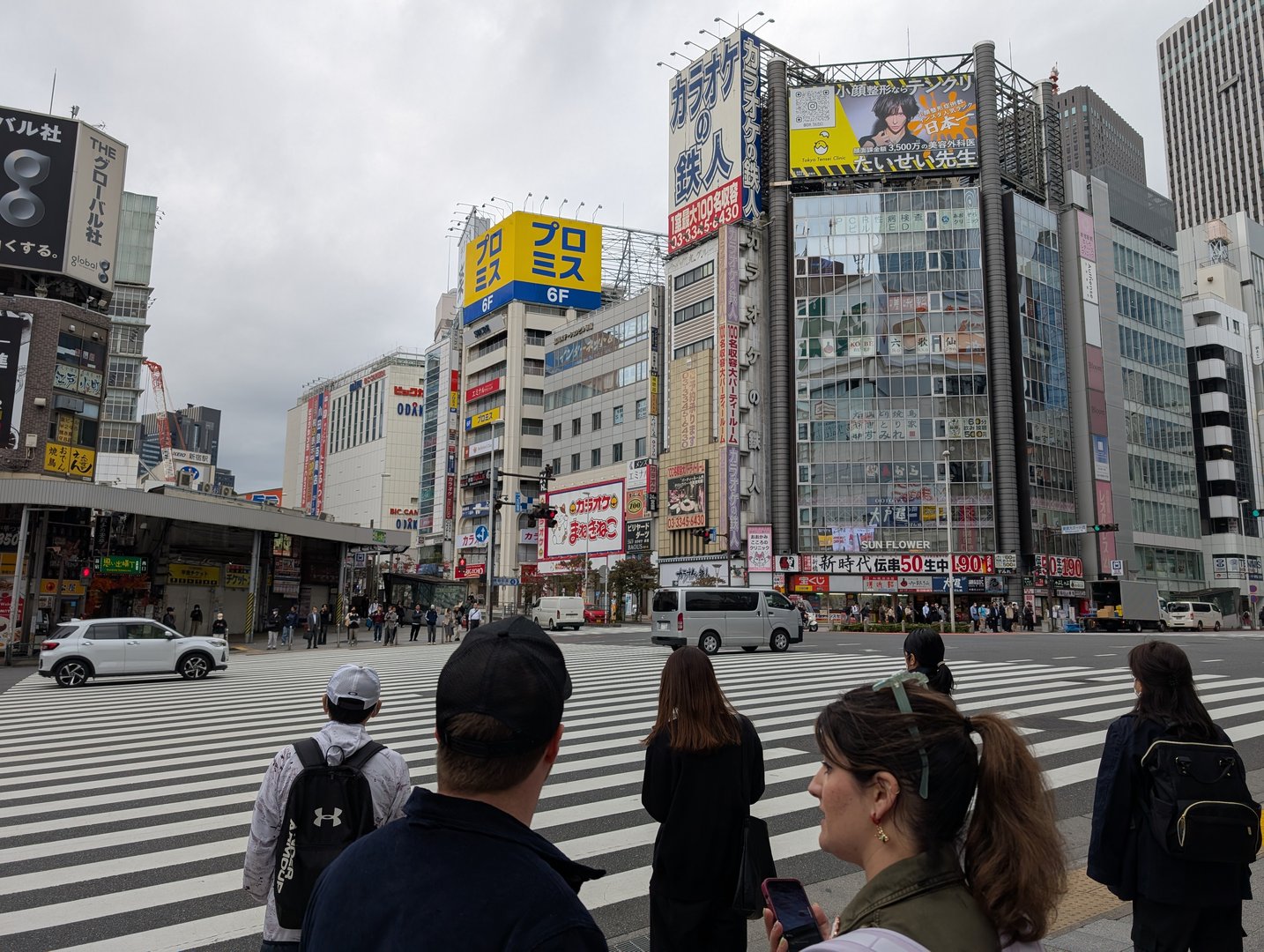 daniel and christina waiting to cross one of shinjuku's MASSIVE zebra crossings on their first morning exploring tokyo