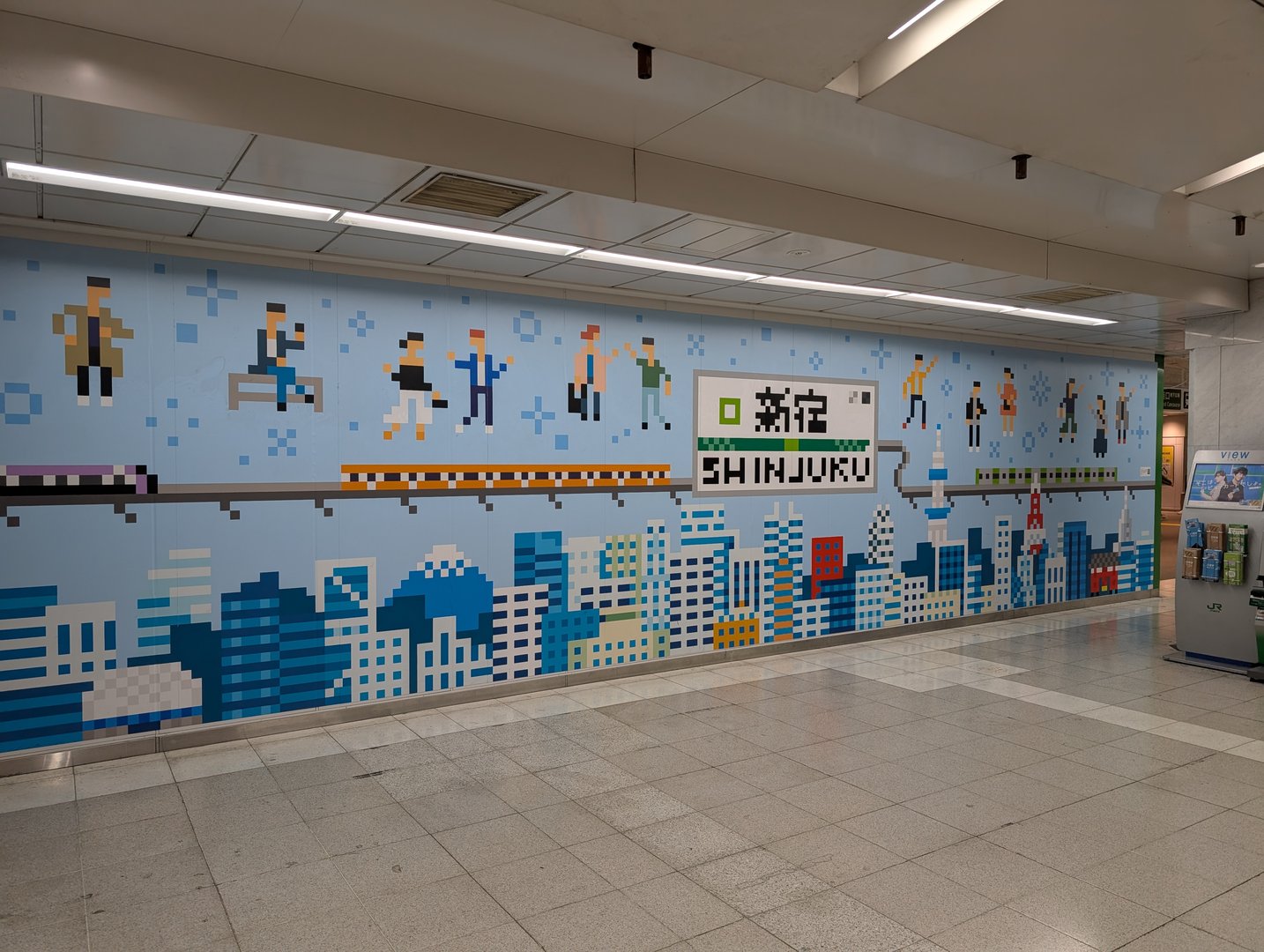 early morning at shinjuku station - this retro pixel art mural perfectly captures the vibe of tokyo's busiest transit hub