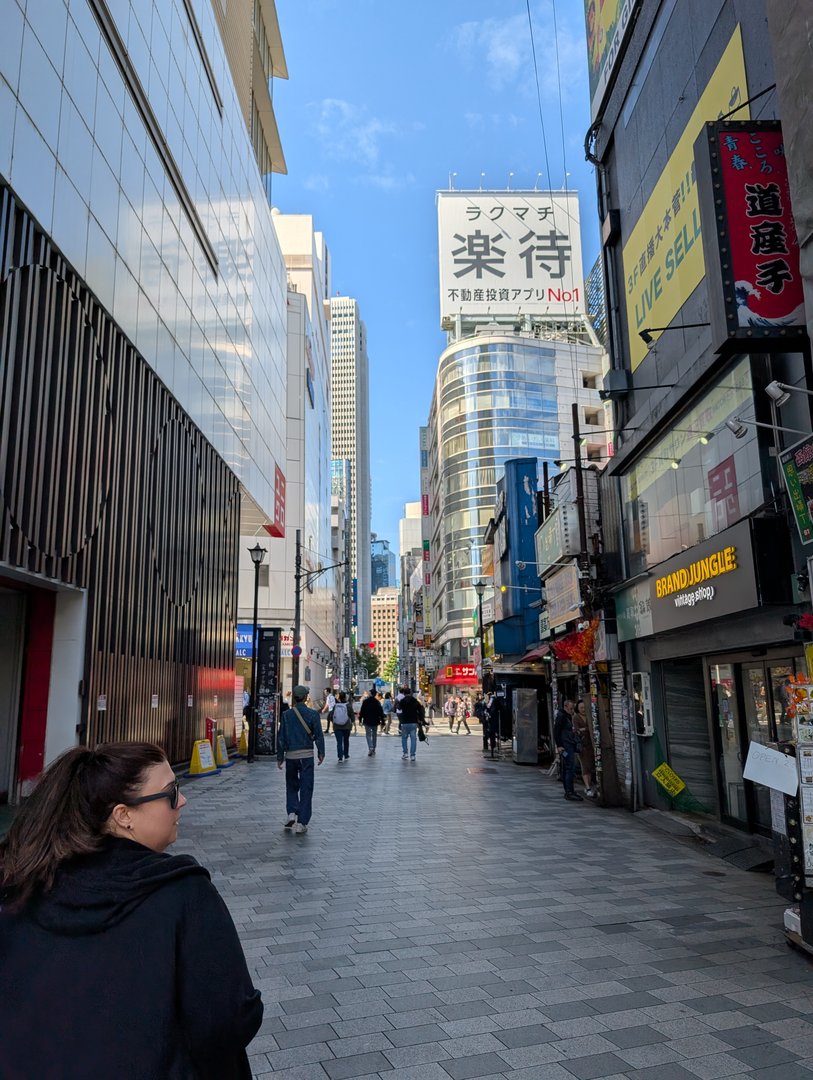 ashley exploring one of shinjuku's many side streets during our morning walk to find coffee. those kanji signs are EVERYWHERE.