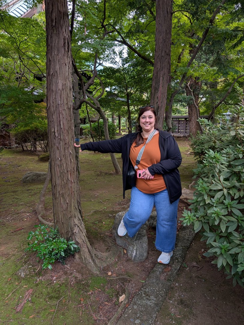 ashley exploring the peaceful grounds of gotokuji temple, where the famous maneki-neko (lucky cat) originated