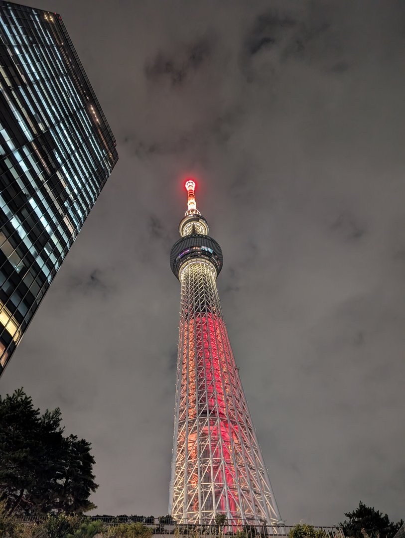 chuck caught the tokyo SKYTREE lit up in its evening colors on our first night exploring sumida. the scale of this thing is WILD.