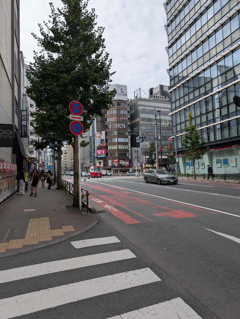 morning walk through shinjuku's business district - those red lanes are bus-only during rush hour