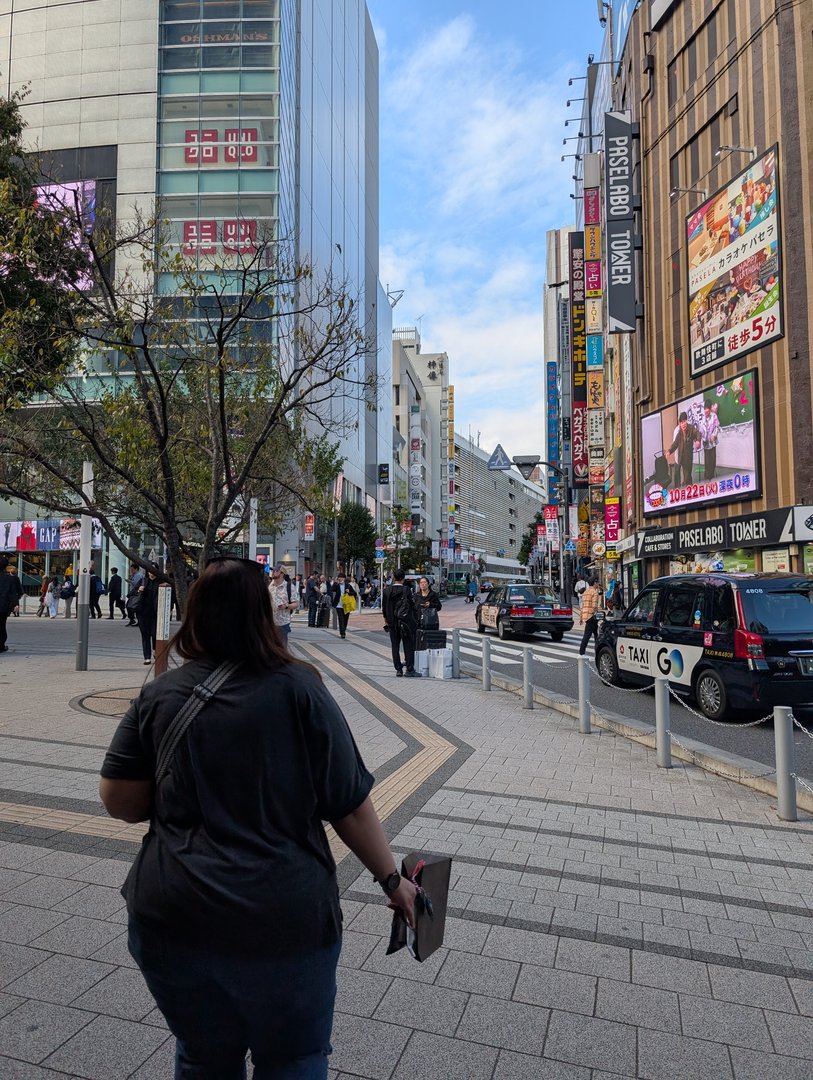 ashley checking out the MASSIVE uniqlo store in shinjuku - this place is like five stories of shopping chaos