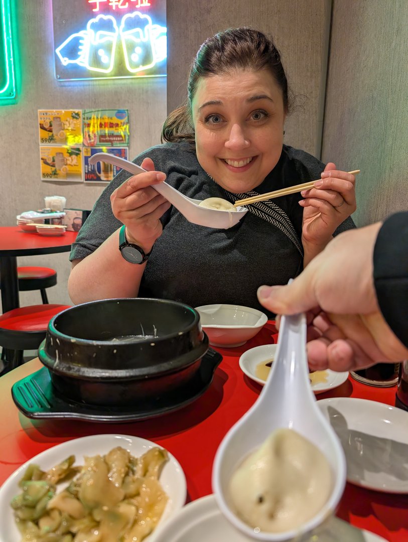 ashley diving into her first REAL xiaolongbao at a tiny dumpling spot in shinjuku. chuck swears these are better than Din Tai Fung