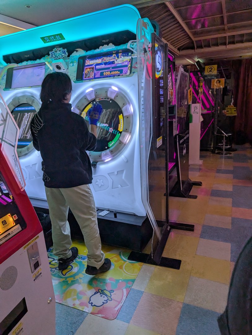 ashley getting way too into a rhythm game at one of shinjuku's MANY arcades. these places are no joke - multiple floors of pure gaming chaos