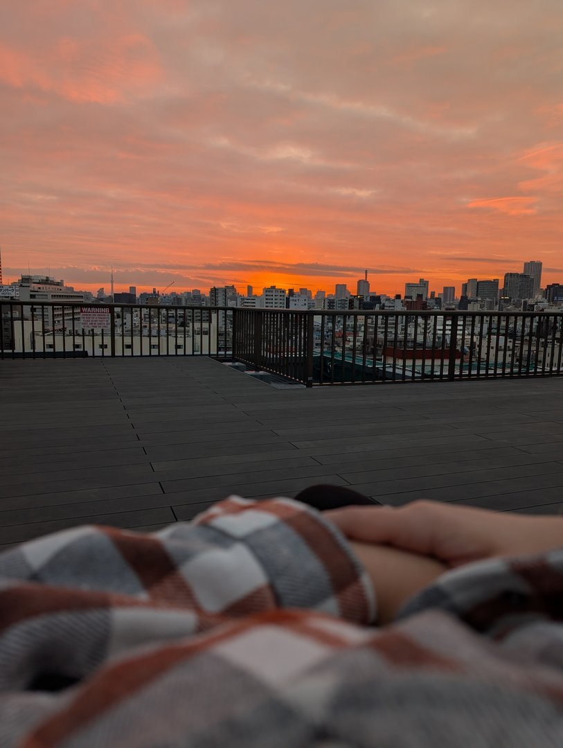 chuck caught this WILD sunrise over shinjuku from our airbnb rooftop - ashley brought up blankets and we just sat there taking it all in