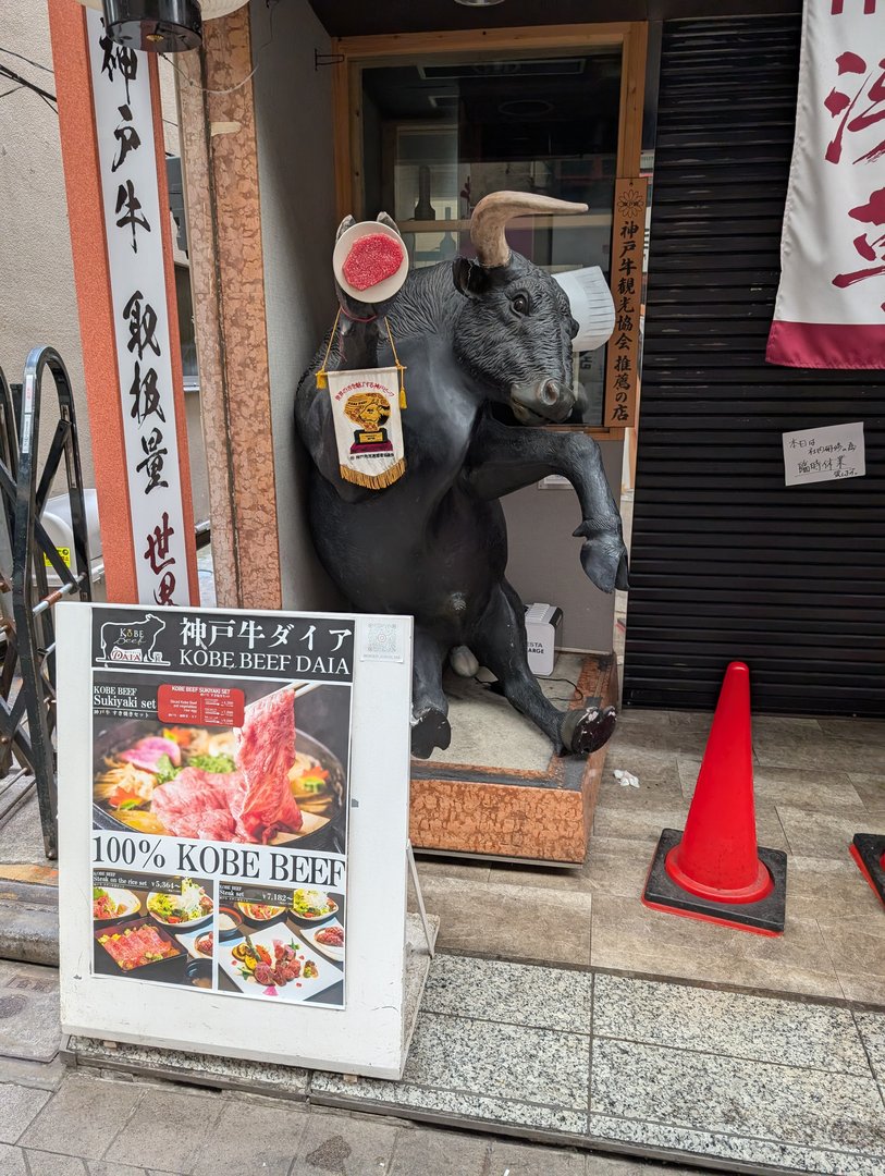 chuck spotted this quirky kobe beef restaurant mascot in taito - definitely not your typical steakhouse decor