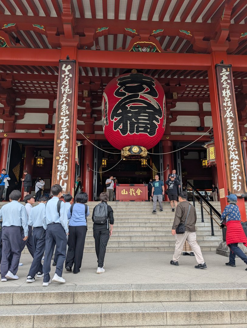 early morning at the MASSIVE kaminarimon gate of senso-ji temple - chuck caught this shot of local students on what looks like a field trip heading inside