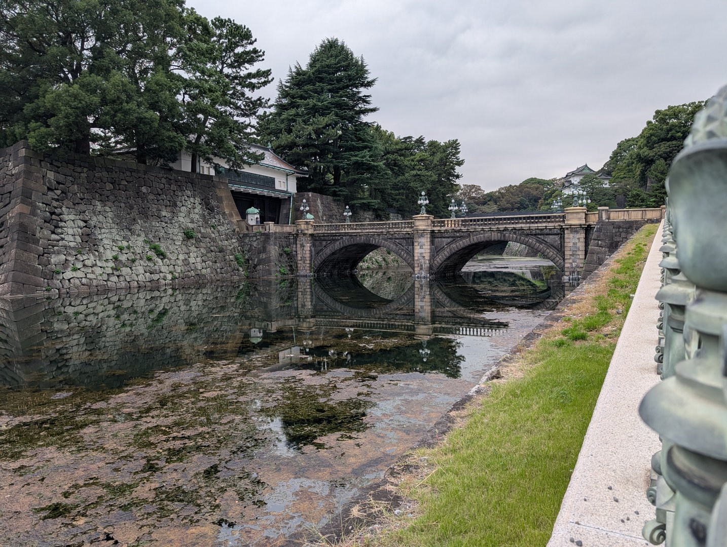 chuck caught this moody shot of the nijubashi bridge at the imperial palace on a cloudy morning. those stone walls have been standing since the EDO period