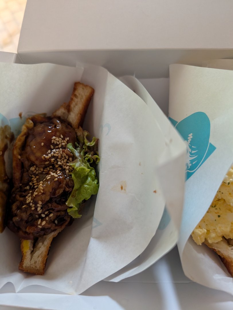 lunch break in ginza - chuck grabbed this AMAZING teriyaki burger from a tiny shop near the station. way better than any fast food back home.