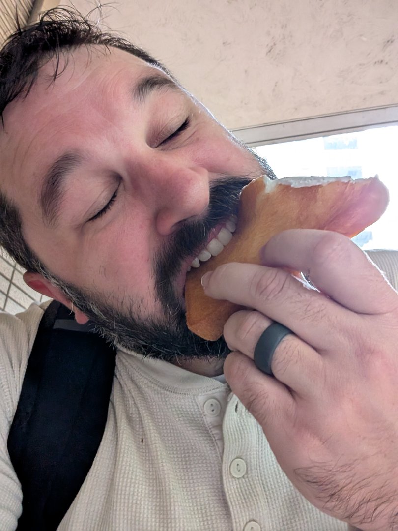 daniel demolishing a fresh tamagoyaki sandwich from lawson in chūō. these convenience store egg sandwiches are NO JOKE.