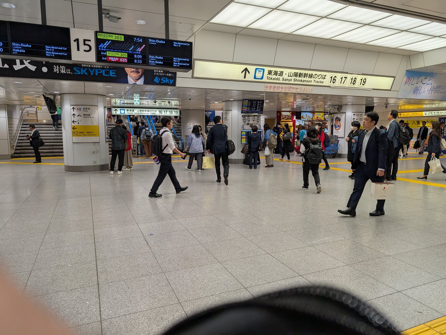 early morning rush at tokyo station, catching the NOZOMI bullet train to osaka. chuck snapped this while we figured out which platform to use.