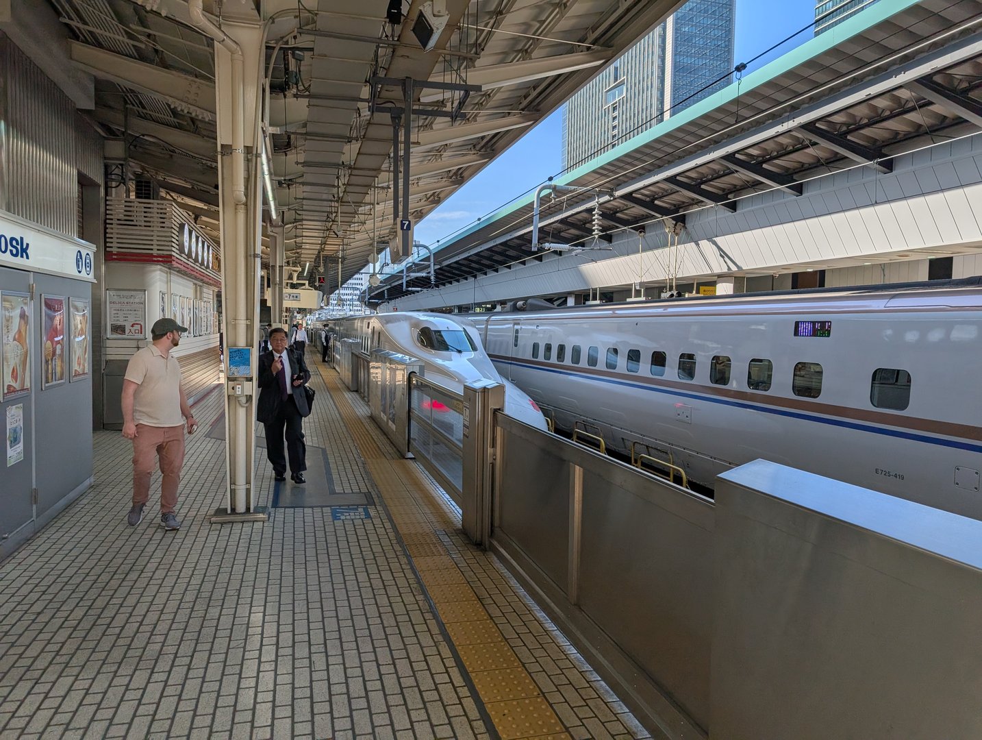 daniel checking out the SLEEK shinkansen at tokyo station before heading to kyoto. these trains are no joke - way smoother than anything back home.