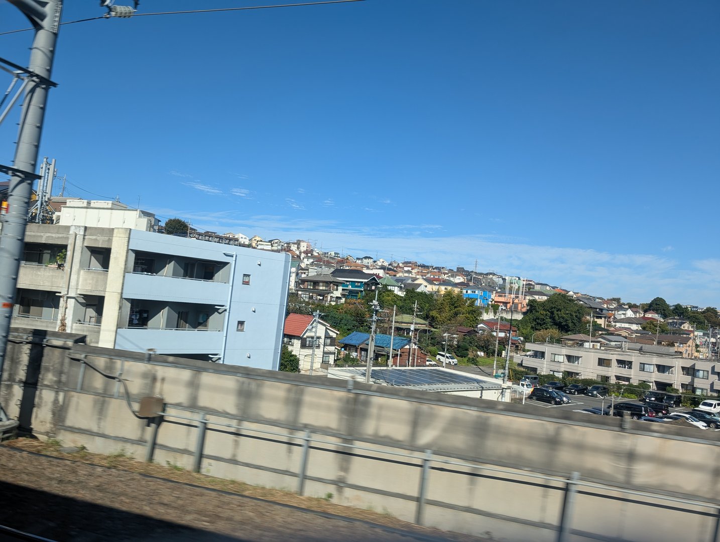 quick glimpse of yokohama's residential hills from the train window on our way to tokyo. chuck snapped this while passing through the REAL japan, away from the tourist spots.