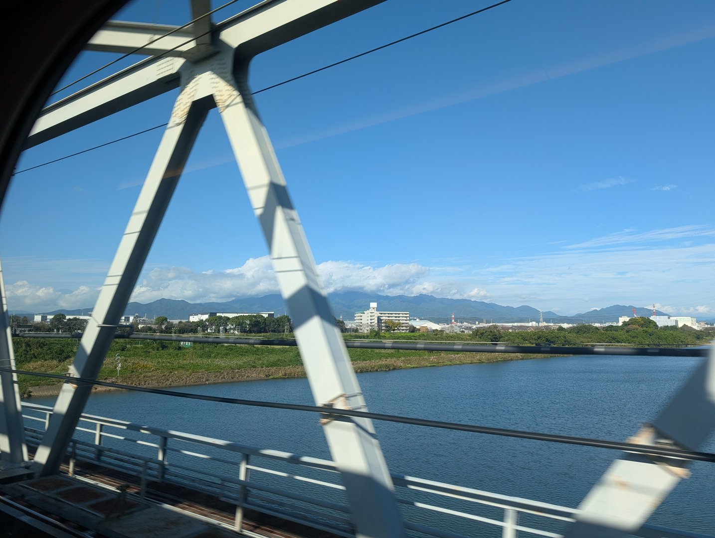 quick snap from the SHINKANSEN as we zoomed past samukawa on our way to kyoto. chuck caught this view of the mekujiri river and mountains while ashley napped.