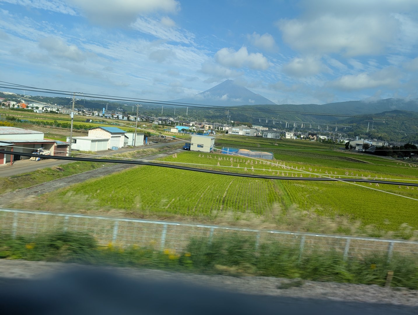 shot from the shinkansen window as we zoomed past nagaizumi - got lucky with this clear view of mt. fuji looming over the rice fields